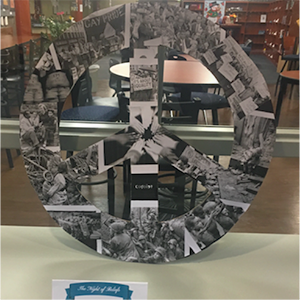 PBL project display: peace sign with social justice photo on it