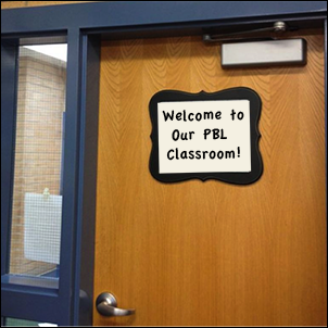 Classroom door with "welcome to our PBL classroom" sign